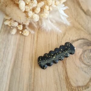 Barrette à cheveux ondulée noire avec éclats dorés